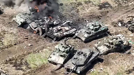 FILE PHOTO: A Leopard 2 tank and several Bradley fighting vehicles destroyed by the Russian forces near Robotino, June 2023.