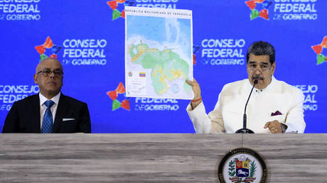 Venezuelan President Nicolas Maduro shows a map of the country, which includes the ‘Guyana Esequiba’ province.