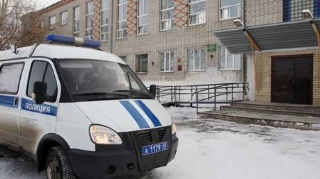 FILE PHOTO: A police vehicle next to a school in Russia.