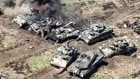  A Leopard 2 tank and several Bradley fighting vehicles destroyed by the Russian forces near Robotino.