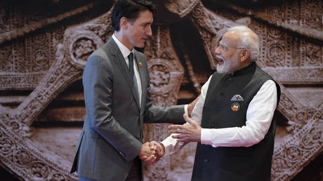 India's Prime Minister Narendra Modi (R) shakes hand with Canada's Prime Minister Justin Trudeau ahead of the G20 Leaders' Summit in New Delhi