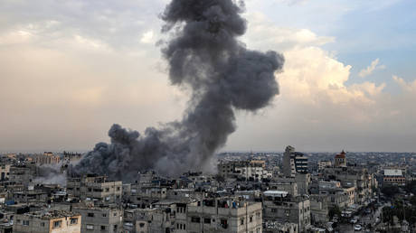 A smoke plume erupts during Israeli bombardment in Rafah in the southern Gaza Strip on December 12, 2023, amid ongoing battles between Israel and the militant group Hamas.