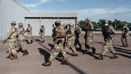 FILE PHOTO: Members of the South African National Defence Force walk as they take part in an integrated multi-disciplinary law enforcement operation in Durban.