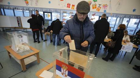 Serbian voters cast their ballots in Belgrade on December 17, 2023.
