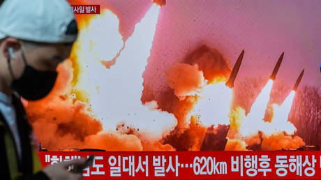 A TV screen shows North Korea's KCNA released picture of North Korea's missile launch during a news program at the Yongsan Railway Station in Seoul, South Korea on March 14, 2023