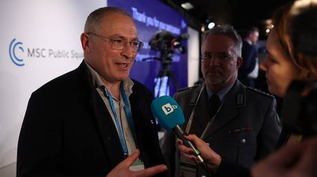 FILE PHOTO: Mikhail Khodorkovsky (L) attends the Munich Security Conference in February 2023.