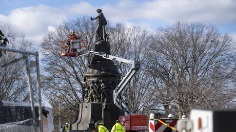 Workers prepare a Confederate Memorial for removal in Arlington National Cemetery on Monday, December 18, 2023 in Arlington, Virginia.