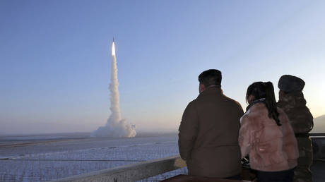 Kim Jong Un and his daughter watch an intercontinental ballistic missile launching from an undisclosed location in North Korea, December 18, 2023