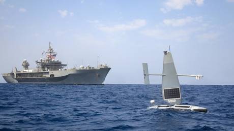 A Saildrone Explorer and the USS Mount Whitney command ship are shown operating in Red Sea waters last April.