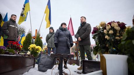 Ukraine’s President Vladimir Zelensky visit graves of Ukrainian soldier at a cemetery in Lviv.