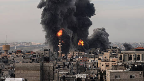 Smoke billows after an Israeli strike over Rafah in the southern Gaza Strip on December 20, 2023.