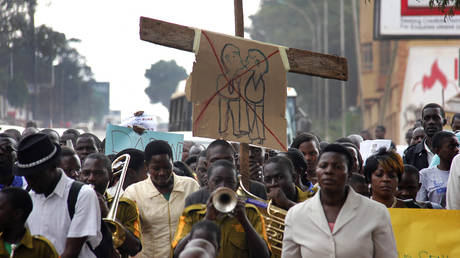 FILE PHOTO: Anti-Homosexual activists march on the streets of Kampala carrying placards.