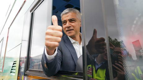 London Mayor Sadiq Khan rides a low-emission bus to help promote a new scrapping program last August.