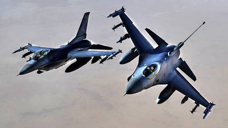 FILE PHOTO: US Air Force F-16 fighter jets fly over Iraq.