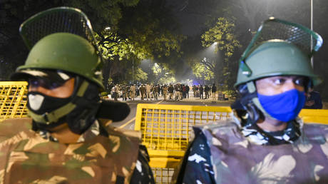 Police cordon off an area at a street after an explosion near the Israeli embassy in New Delhi on January 29, 2021.