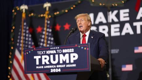 Former US President Donald Trump speaks at a campaign event in Waterloo, Iowa on December 19, 2023.