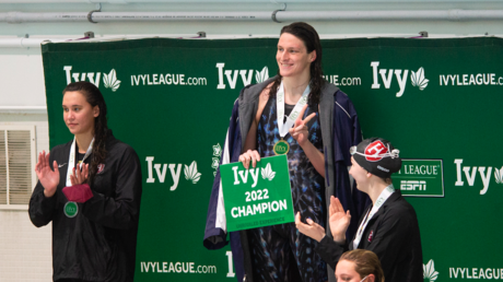 Swimmer Lia Thomas smiles on the podium after winning the 200 yard freestyle during the 2022 Ivy League Women's Swimming and Diving Championships at Blodgett Pool on February 18, 2022 in Cambridge, Massachusetts
