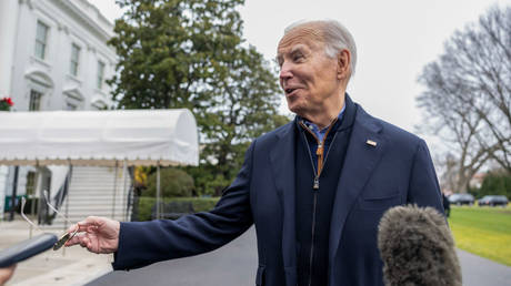 US President Joe Biden speaks to reporters outside the White House on December 23.