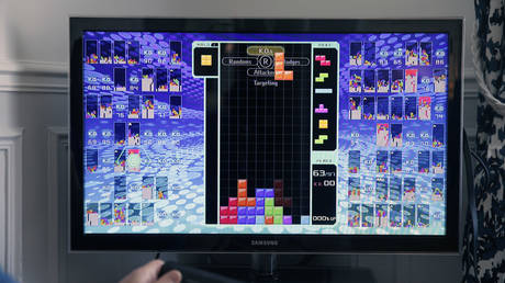In this photo illustration a gamer plays the game Tetris 99 developed by Arika and published by Nintendo on February 18, 2019 in Paris, France