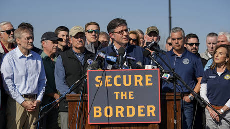 US House Speaker Mike Johnson speaks while standing with Republican members of Congress, Jan. 3, 2024, in Eagle Pass, Texas