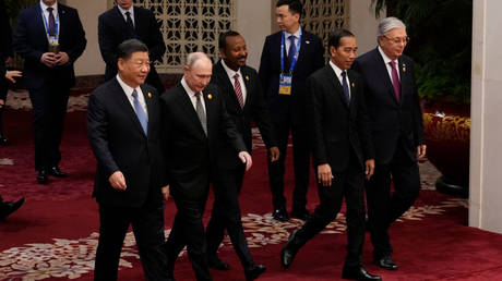 Chinese President Xi Jinping, Russian President Vladimir Putin, Ethiopian Prime Minister Abiy Ahmed, Indonesian President Joko Widodo and Kazakhstan President Kassym-Jomart Tokayev head to a group photo session at the third Belt and Road Forum on October 18, 2023 in Beijing, China.