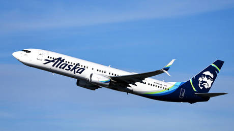 An Alaska Airlines plane takes off from Los Angeles International Airport (LAX) on December 4, 2023 in Los Angeles, California