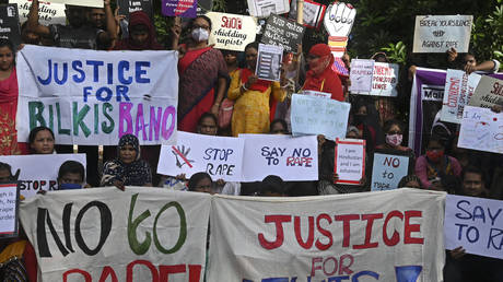 Social activists take part in a protest rally in support of Muslim woman Bilkis Bano, in Kolkata on August 24, 2022.
