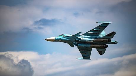 A Russian Sukhoi Su-34 fighter jet flies in the course of Russia's military operation against Ukraine, at the unknown location.