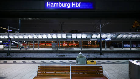 A passenger waits for his train at the main station on 10 January 2024, Hamburg, Germany.