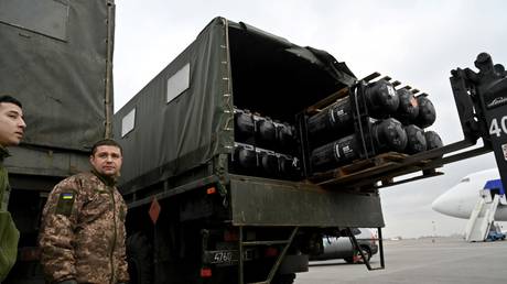 FILE PHOTO: Ukrainian servicemen load a truck with the FGM-148 Javelin, American man-portable anti-tank missile provided by US to Ukraine as part of a military support.