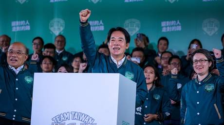 FILE PHOTO: Taiwan’s president-elect from the Democratic Progressive Party, Lai Ching-te (C), addresses supporters.