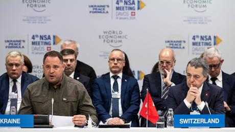 Head of the Ukrainian President's Office Andrey Yermak and Swiss Federal Councillor Ignazio Cassis attend a meeting on the peace formula for Ukraine, in Davos, on January 14, 2024.