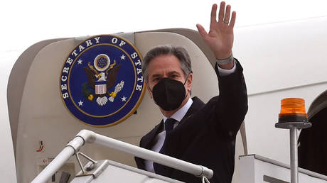 FILE PHOTO: US Secretary of State Antony Blinken waves as he comes off his plane during a February 2022 trip to Melbourne, Australia.