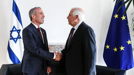 FILE PHOTO: European Commission vice-president in charge for High-Representative of the Union for Foreign Policy and Security Policy Josep Borrell (R) speaks with Israeli Intelligence Minister Elazar Stern (L).