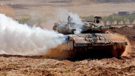 An Israeli Merkava tank takes part in a military drill near the border with Lebanon.