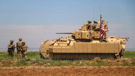 A US reinforcement convoy travels last August near Deir Ez-zor, Syria.