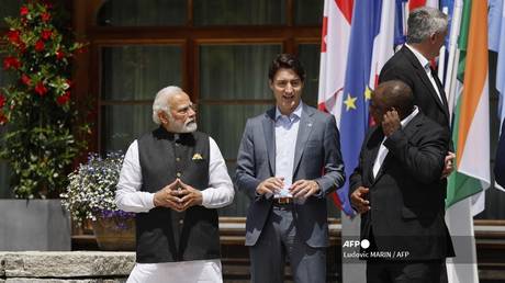 FILE PHOTO: India's Prime Minister Narendra Modi (L), and Canada's Prime Minister Justin Trudeau (C) chat before a group picture at Elmau Castle, southern Germany, where the German Chancellor held a summit of the Group of Seven rich nations (G7) in 2022.