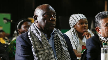 South African President Cyril Ramaphosa (L) listens to the ruling from the top UN court that harshly criticized Israel's war against Hamas,  in Johannesburg, South Africa, January 26, 2024.