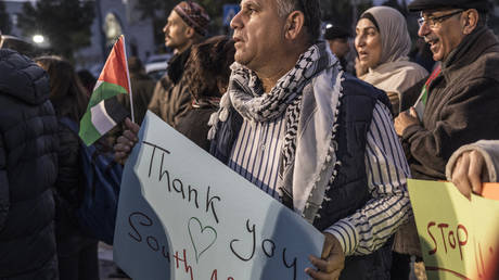 People celebrate a landmark 'genocide' case filed by South Africa against Israel at the International Court of Justice, in the occupied West Bank city of Ramallah on January 10, 2024