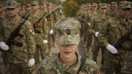 Military students stand in formation at a swearing in ceremony on the Romanian Army Day in Bucharest, Romania, October 25, 2023