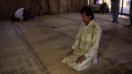 Imran Khan at prayer in a mosque
