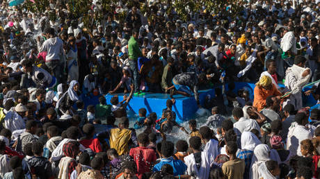 FILE PHOTO: Holy water sprayed onto the crowd attending Timkat celebrations of epiphany on January 19, 2017 in Lalibela, Ethiopia.
