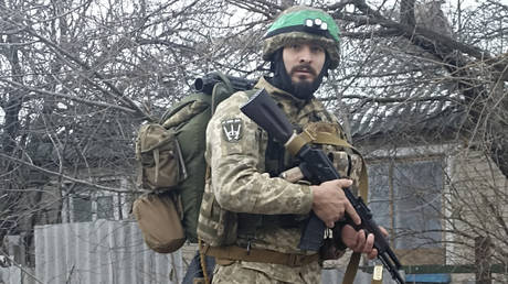 A 32-year-old professional soldier from Medellín, Colombia who goes by the call sign Checho and was featured in the AP story.