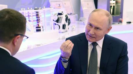 Russian President Vladimir Putin speaks to Rossiya 1 TV channel correspondent Pavel Zarubin in Moscow, February 14, 2024