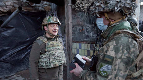 FILE PHOTO: Ukrainian President Vladimir Zelensky visits troops on February 17, 2022