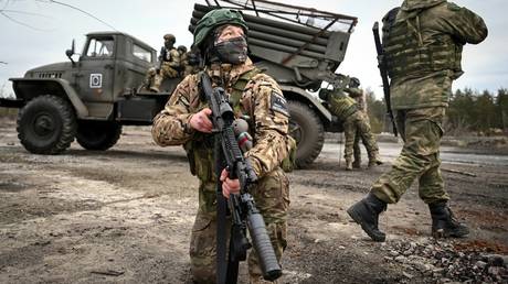 Russian servicemen serve a BM-21 Grad multiple rocket launcher in the Krasnyi Lyman, also known as Lyman, sector of the frontline amid Russia's military operation in Ukraine, Russia.