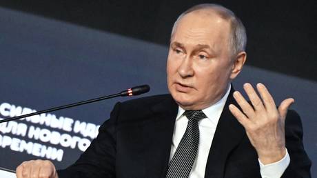 Russian President Vladimir Putin attends a plenary session of the Strong Ideas for a New Time forum held by the Agency for Strategic Initiatives autonomous non-profit organisation in Moscow, Russia.
