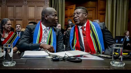 South Africa Minister of Justice Ronald Lamola and South African Ambassador to the Netherlands Vusimuzi Madonsela attend the International Court of Justice (ICJ) ahead of the hearing of the genocide case against Israel brought by South Africa, in The Hague on January 11, 2024.