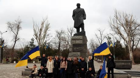 FILE PHOTO: Ukrainian students and cadets in front of a monument to Taras Shevchenko in Odessa.