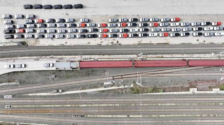 CHONGQING, CHINA - OCTOBER 11, 2023 - Staff load cars onto a train for export to Russia.